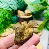 Working On Tigerās Eye Rough Stone - rawstone