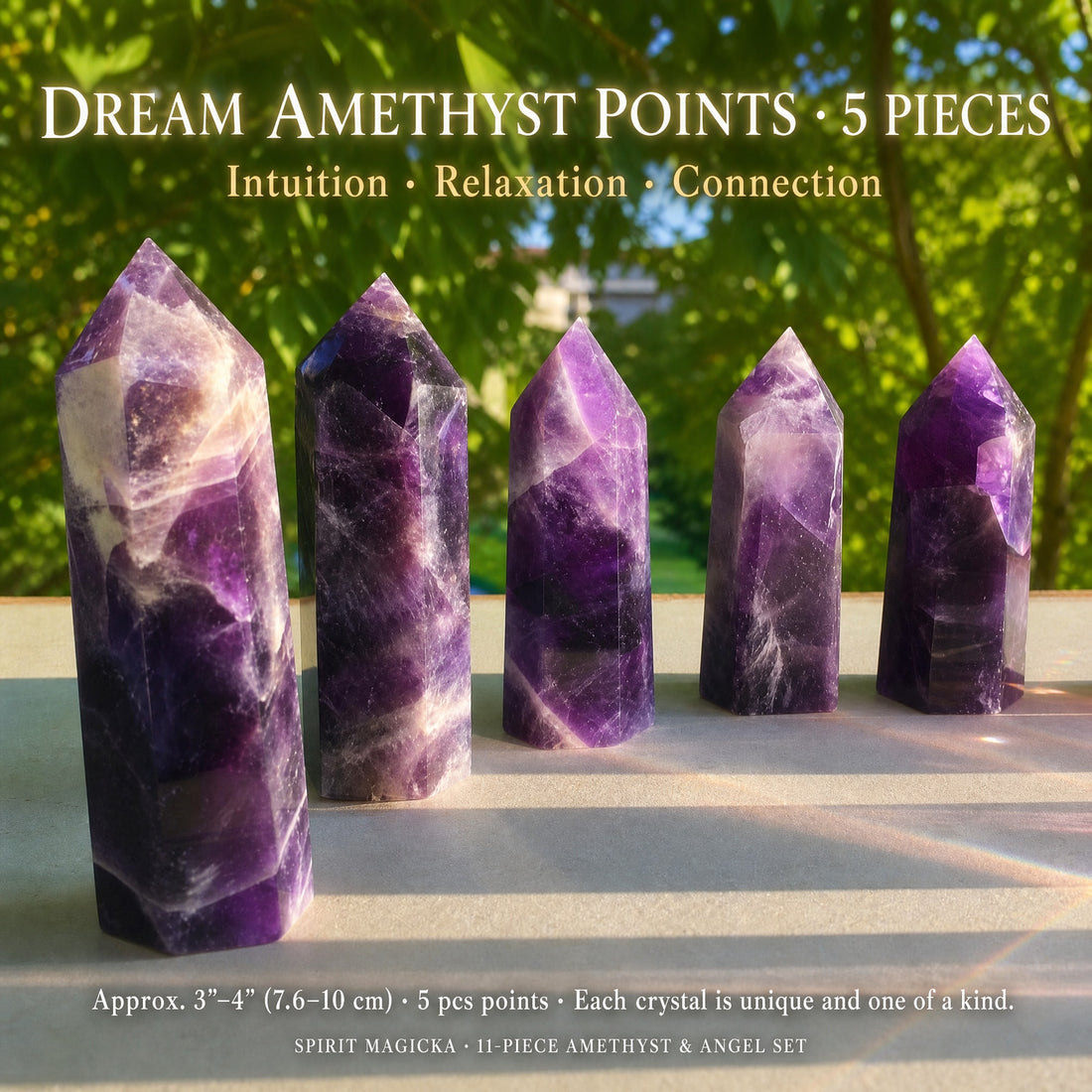Five dream amethyst points banded in deep violet and white, standing in a row in front of green trees
