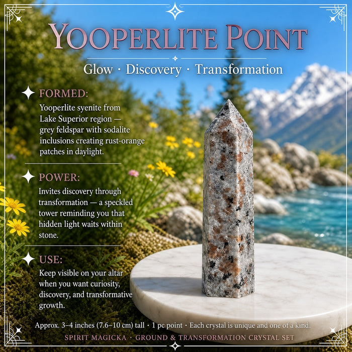 Speckled grey yooperlite point on a marble dish