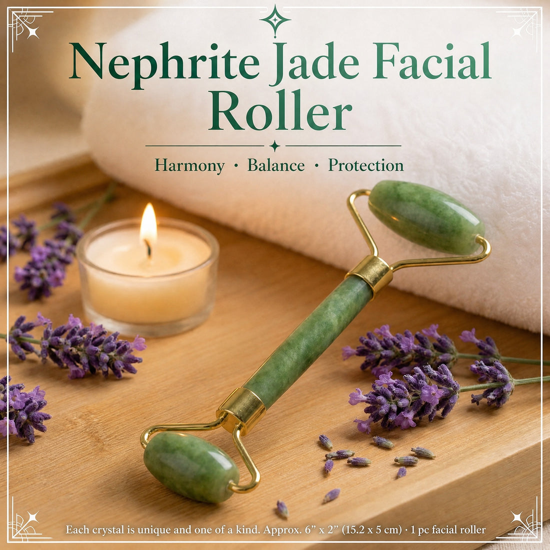 A dual-ended green nephrite jade facial roller with a gold frame on a wooden tray beside a candle and lavender