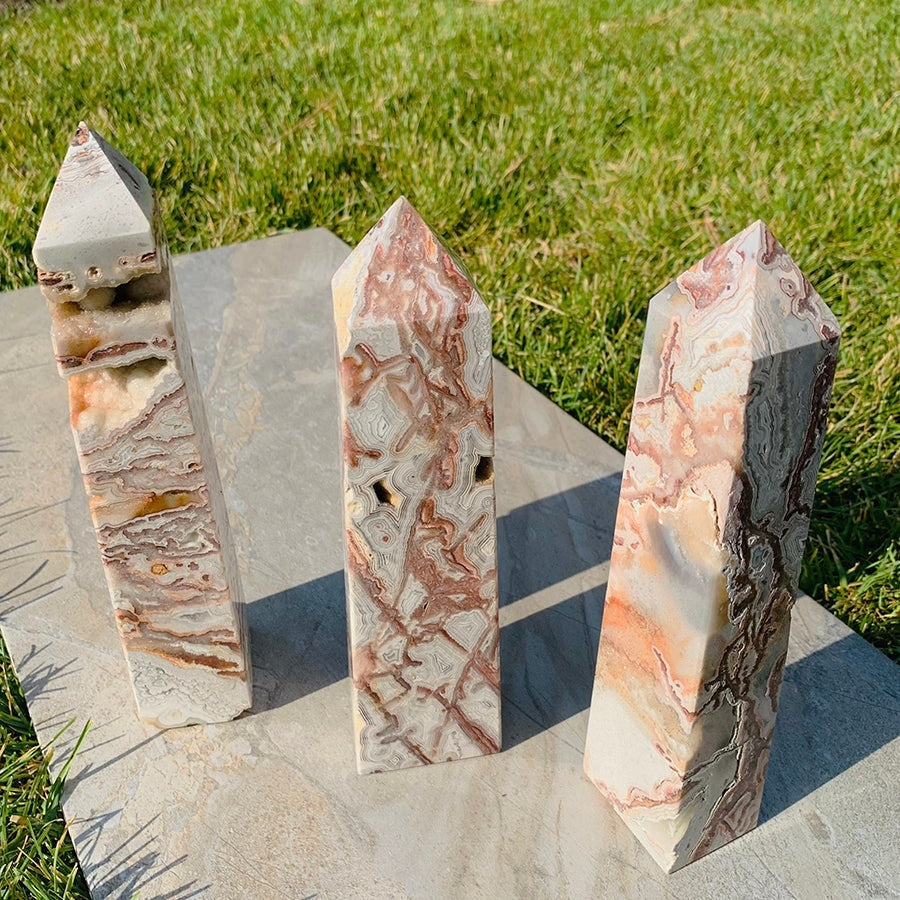 Three Mexican lace agate druzy generators side by side, each with its own lace pattern and druzy pockets